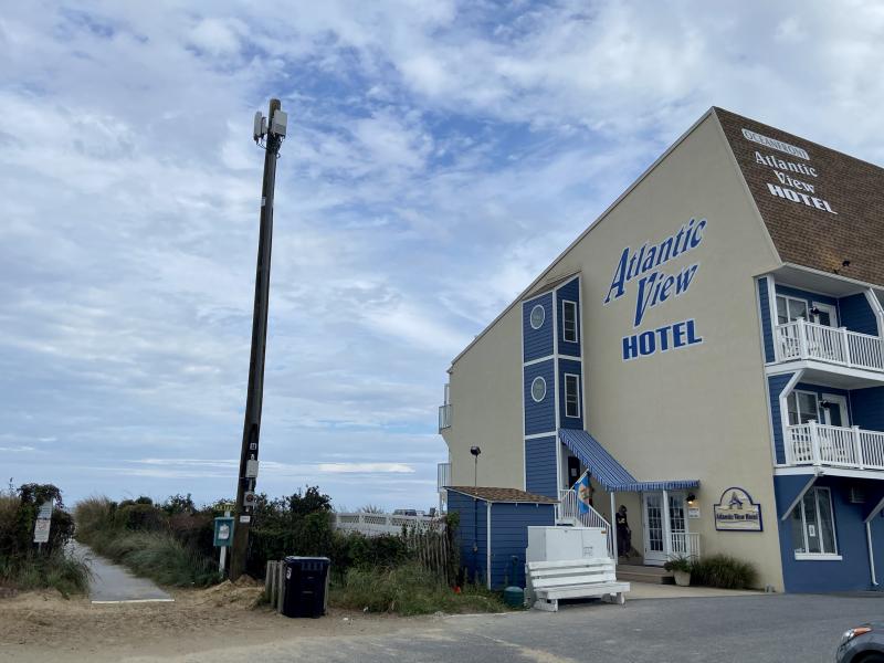 The view from the Atlantic View Hotel on Clayton Street in Dewey Beach now includes a 5G pole. Residents say placement of the poles throughout town and adjacent to the beach is creating eyesores, but town officials say little can be done, as state law allows for the installation of the poles on state rights of way. ELLEN DRISCOLL PHOTO